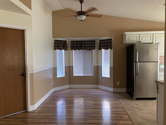 Dining room. Bathroom door to the left. Kitchen to the right.