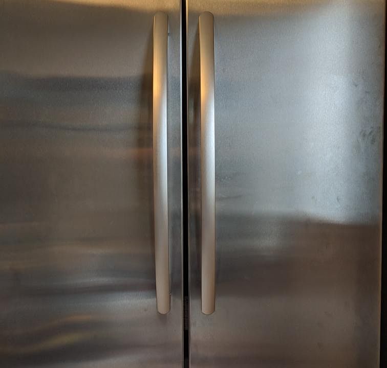 Full size Kitchen Aid fridge in updated kitchen.