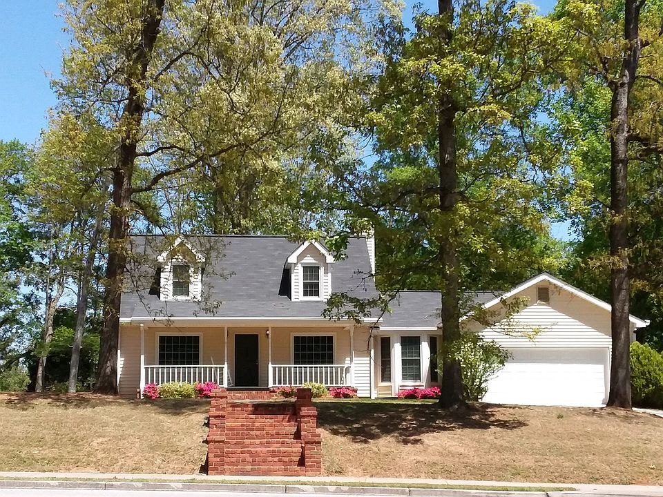 Hardwoods surround the home.