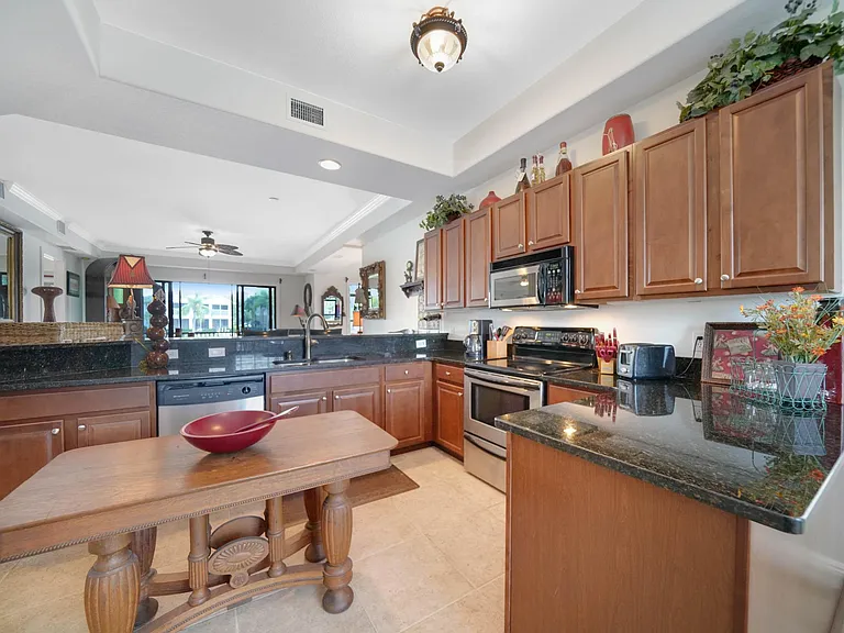 Kitchen overlooking living room and lanai beyond.