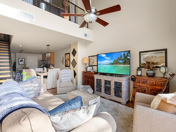 Spacious vaulted ceilings with bedroom balcony