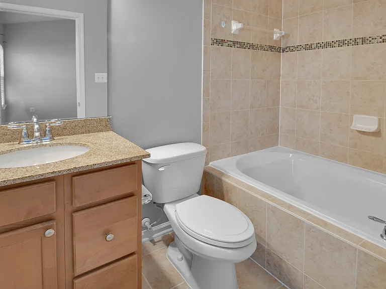 Full Bathroom #2- En Suite to Primary Bedroom (Upper Level)