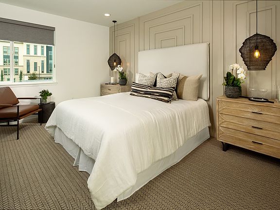 Natural light flows into the hallway and stairwell upstairs to the primary suite and bedrooms. Prim