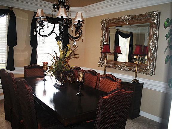 At dinner time, the party easily moves into the luxurious formal dining room. Kitchen is right off t