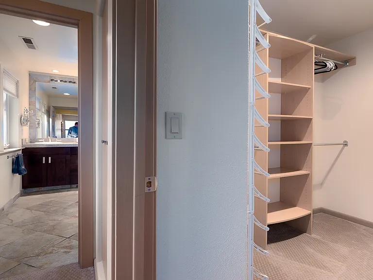 Walk-in Closet from bedroom to primary bath.
