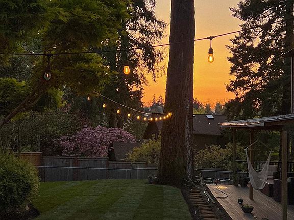 Backyard lawn and lower covered deck area