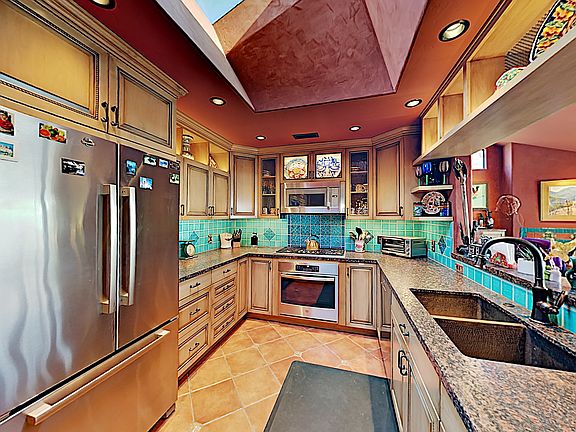 Fully stocked gourmet kitchen while gazing at the ocean