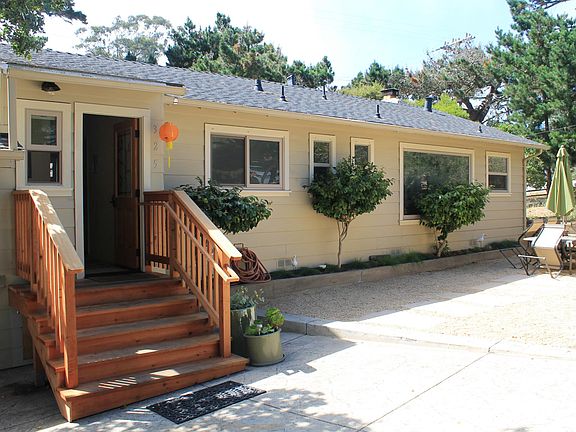 Back entry and patio from parking.