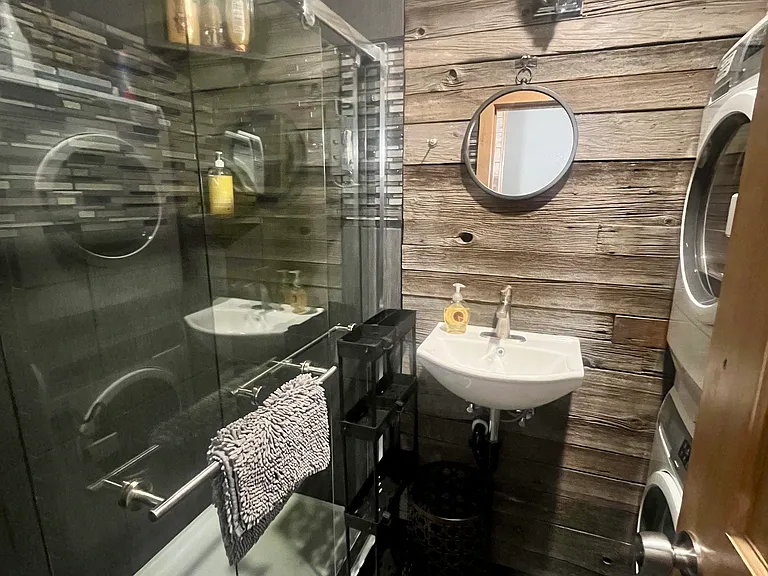 Bathroom includes the washer/dryer stack.