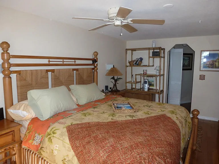 UPSTAIRS MAST BEDROOM WITH HIGH END TOMMY BAHAMA FURNISHINGS AND HIGH-END VARA WANG KING MATTRESS.