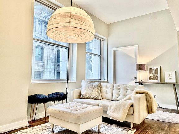 Living room area in 08 tier apartments with NE city view of Millennium Park.