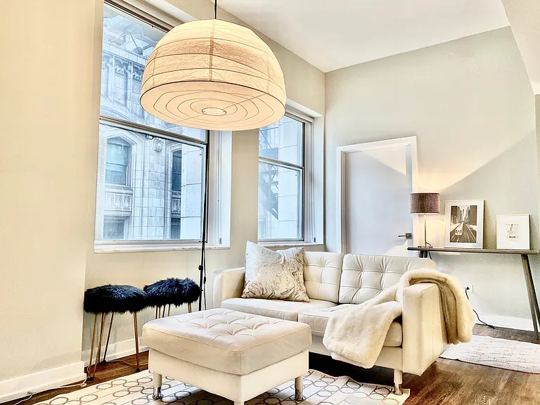 Living room area in 08 tier apartments with NE city view of Millennium Park.