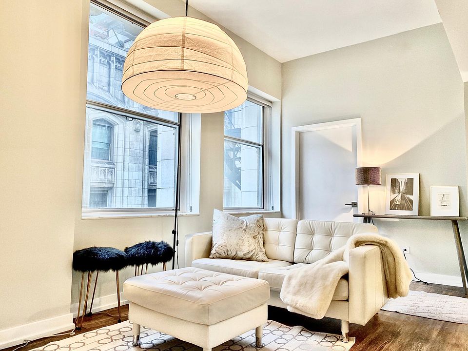 Living room area in 08 tier apartments with NE city view of Millennium Park.