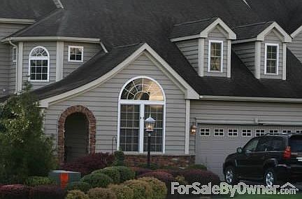 Front left Angle/ Lots of landscaping
						:
						Unbuilt lot nextdoor will always remain unbuilt. Premium lot backing to woods.