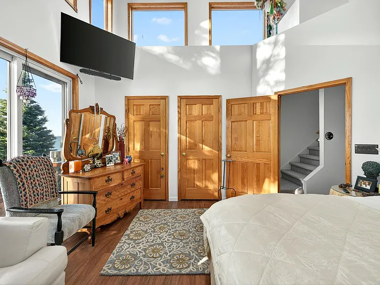Master Bedroom with 55" Samsung & speaker.