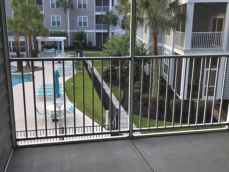 Balcony with view of pool