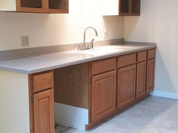 Kitchen/dining area with vaulted ceiling.
