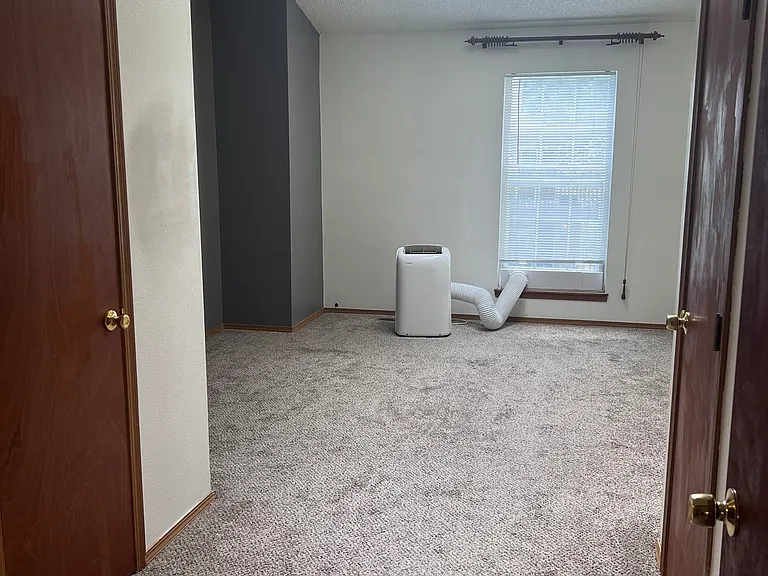 Spacious master bedroom with two large closets.