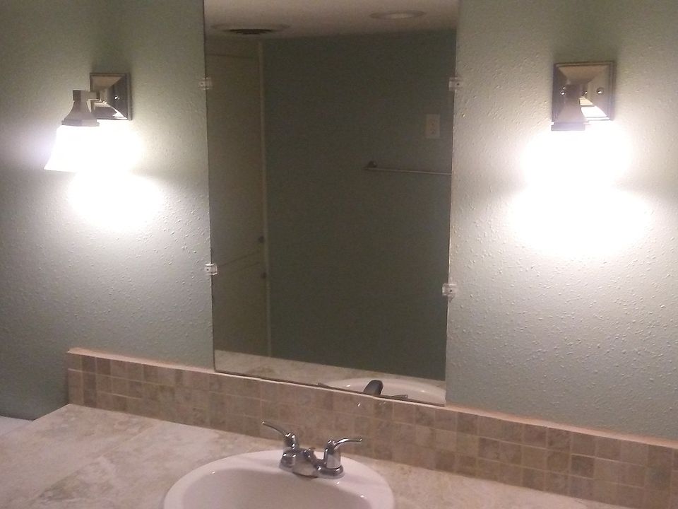 Full bath, remodeled with single sink.