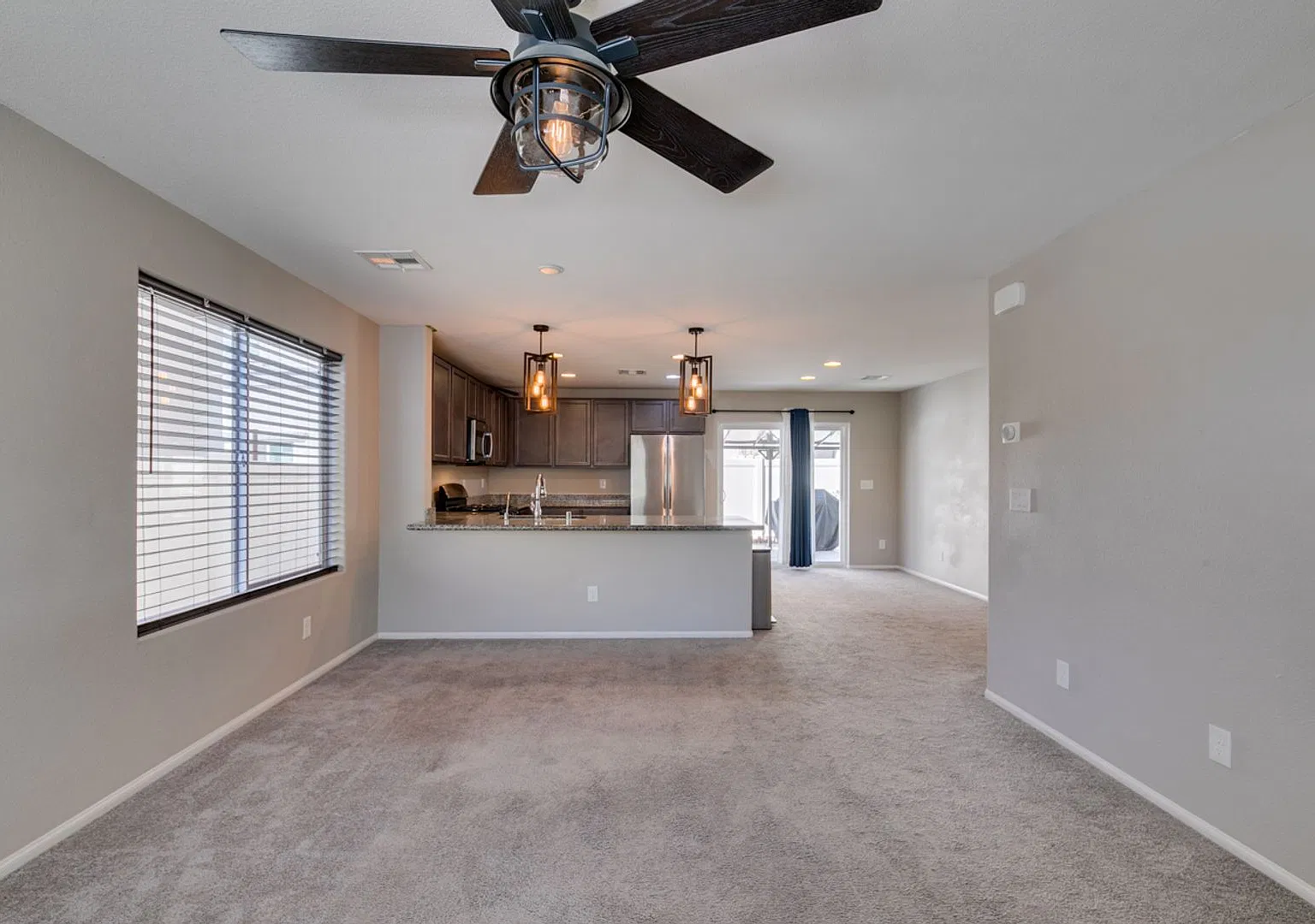 3-bedroom home featuring granite countertops, stainless steel appliances, and a covered backyard ... — Photo 4
