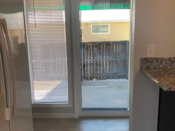 Hall to Backyard Patio & Lower Level Staircase