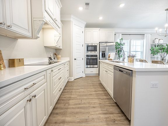 Kitchen in the Claiborne floorplan at a Meritage Homes community in Gulfport, MS.