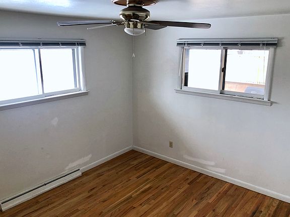 Bedroom 1: Fan/closet/wood