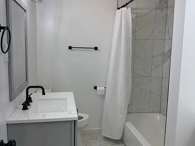 Beautifully updated bathroom featuring modern finishes, stylish fixtures, and a clean, contemporary design