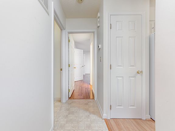 Hall leading from foyer to kitchen to living