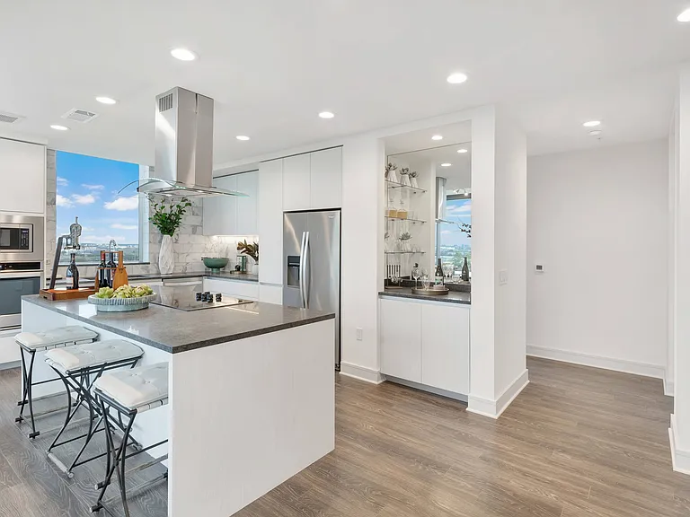 Spacious kitchen islands and dry bars in select residences