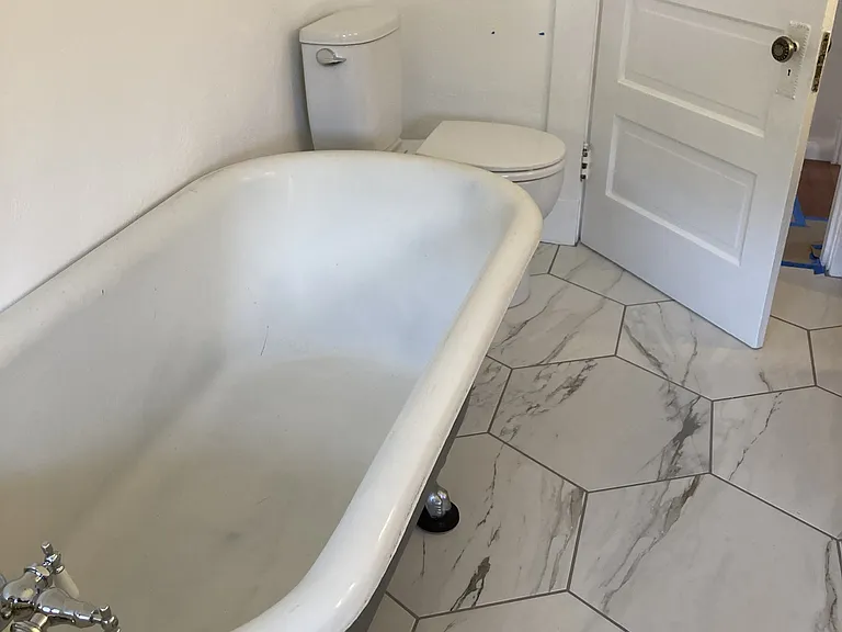 Please note that tub does have shower fixture and curtain (photos taken prior to completion)