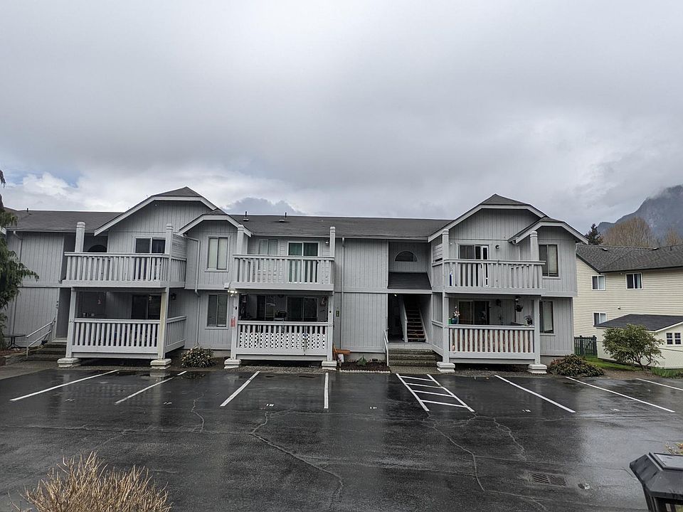 The unit is in the upper corner of an 8-plex on the river