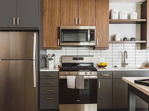 Kitchens with chef-islands, two-toned cabinetry with chrome pulls