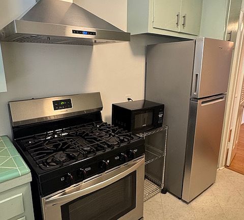 Kitchen - 1-year-old range, range hood, fridge and microwave