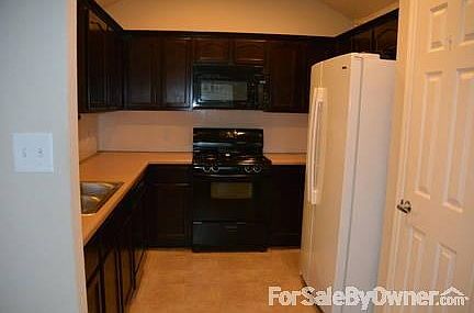 Full Kitchen, Pantry to the right
						:
						The microwave, stove, &dishwasher all stay.The over-sized fridge is negotiable.