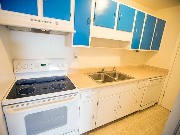 Kitchen leading to in unit W/D