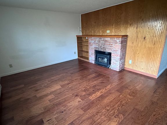 Living room. 
Quality wood floors. 
Wood and electric heat.