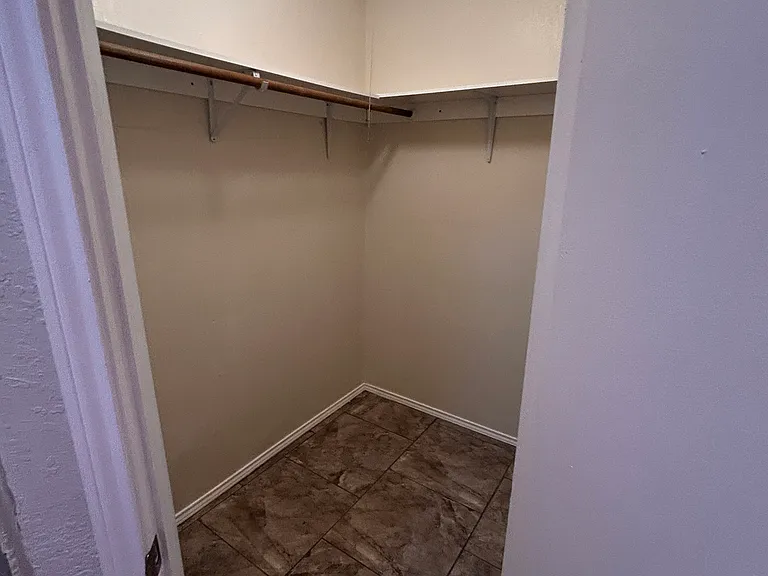 His closet in master bathroom