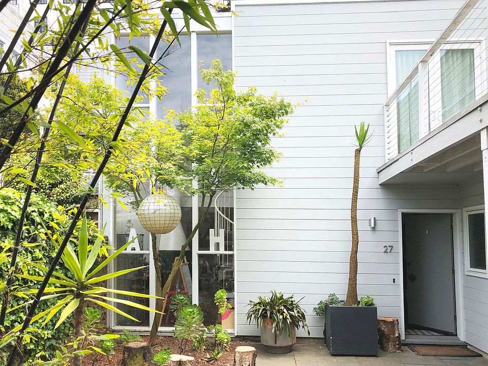 Private entry with large slate courtyard and deck