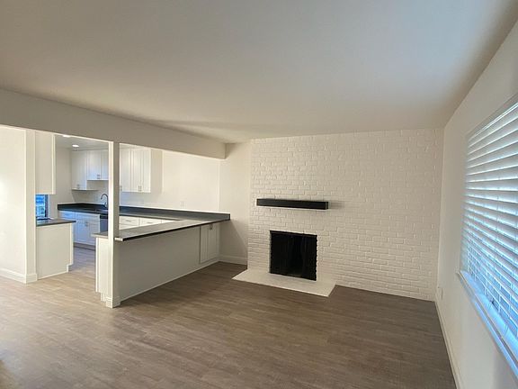 Living Room with Fireplace and Breakfast Bar