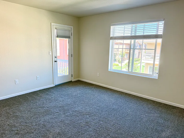 Master Bedroom with door to East Balcony