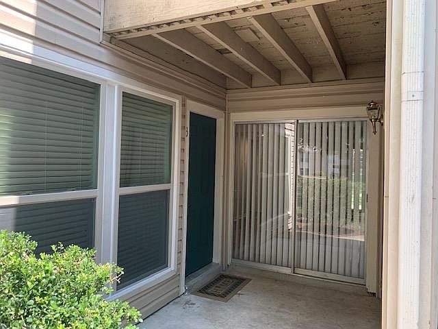 Front door entrance, new windows on the left. Push button combination lock for keyless entry.