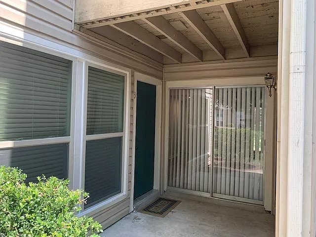 Front door entrance, new windows on the left. Push button combination lock for keyless entry. - 6683 Whispering Oak Pl #3