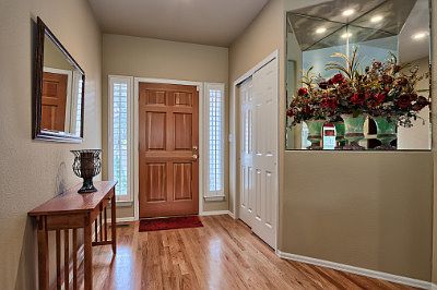 Entryway with hardwood floors and spacious double closet