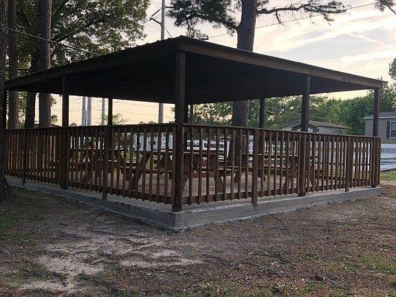 This is our picnic area that we provide for our residents. It's a great place to have a meal with family and friends. We also have a playground next to this for the kids to play on while others visit.
