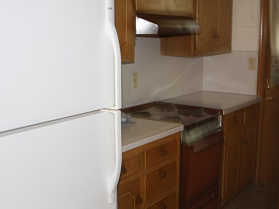 Kitchen with washer/dryer, nice refrigerator with ice maker.