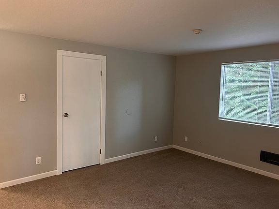 Living Room showing front window and guest closet.