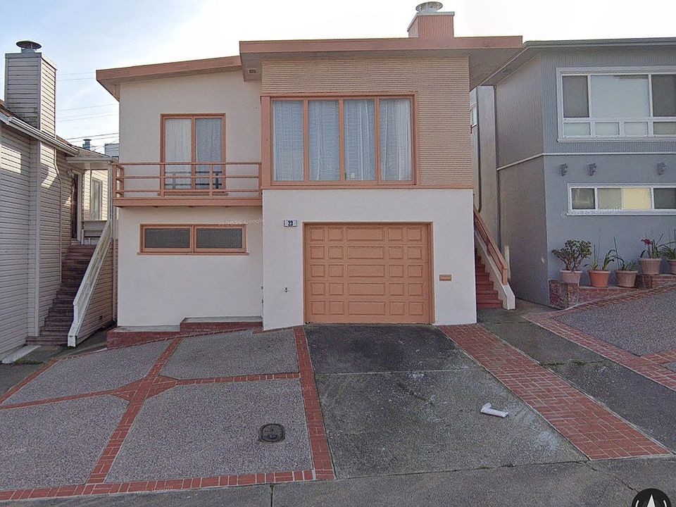 Front of House with Driveway and Paved Front Yard