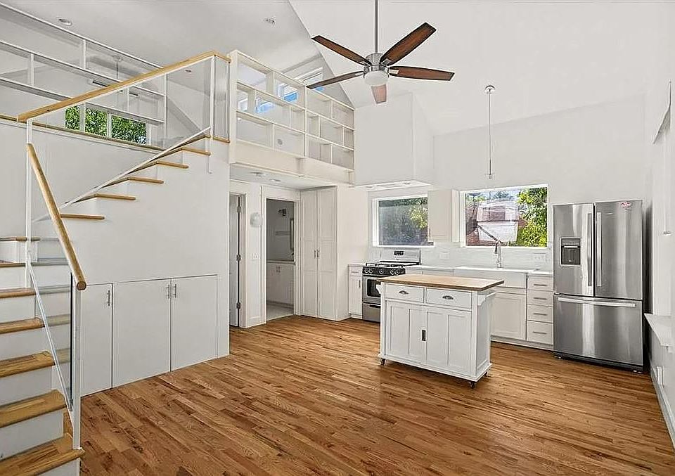 Living area and kitchen, standing inside front door.