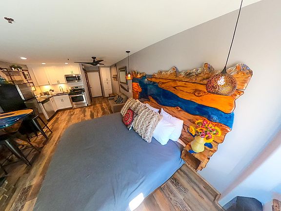 King size custom bed w/ charger ports built in.